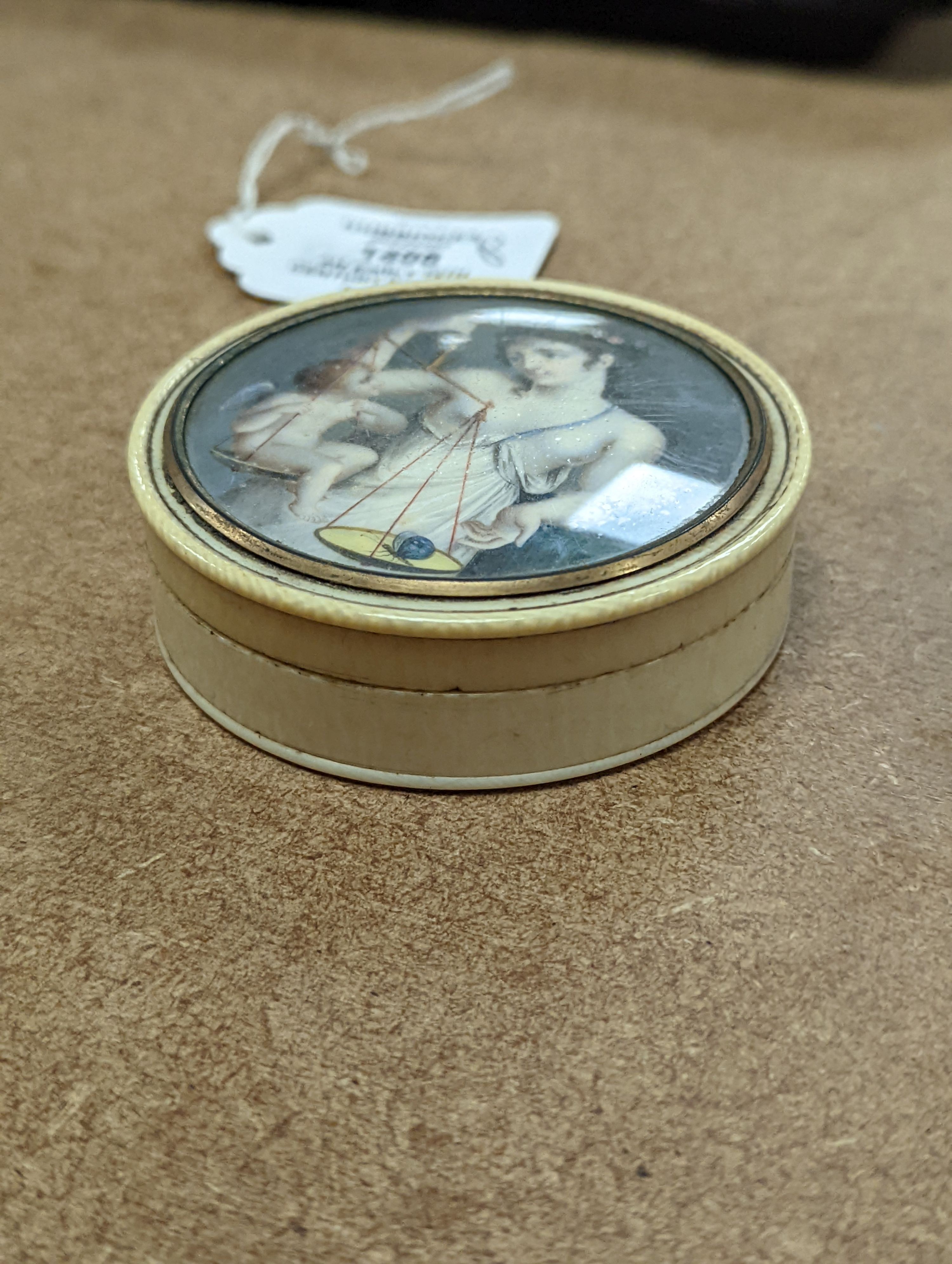An early 19th century ivory and tortoishell box with inset miniature of Themis to cover, 8cm.